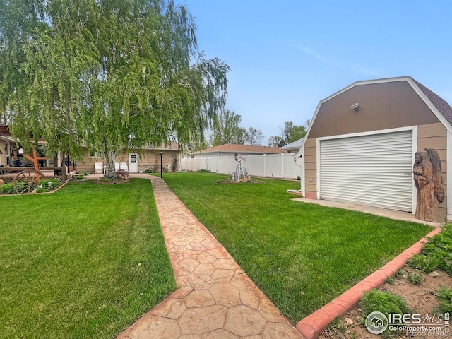 1145 S Bowman Ave, Holyoke, CO 80734 - view of yard featuring an outbuilding and a detached garage