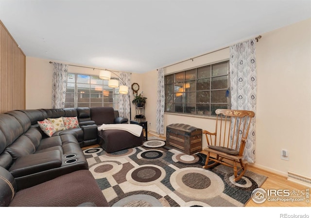 living area featuring wood finished floors and baseboards