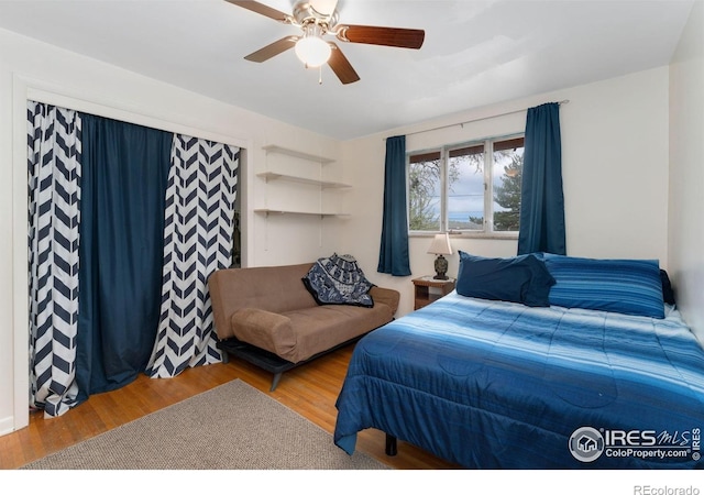 bedroom with wood finished floors and ceiling fan