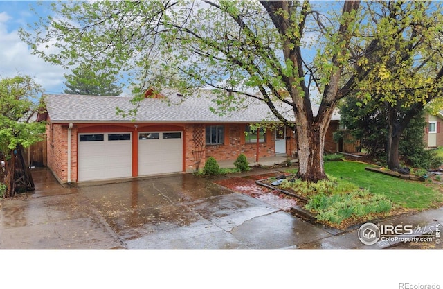ranch-style house featuring brick siding, a garage, driveway, and roof with shingles