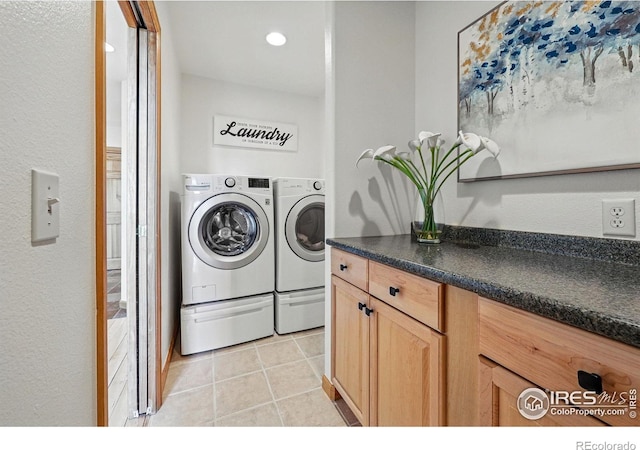 laundry room with independent washer and dryer, light tile patterned floors, and recessed lighting