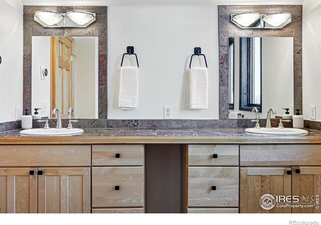full bathroom featuring double vanity