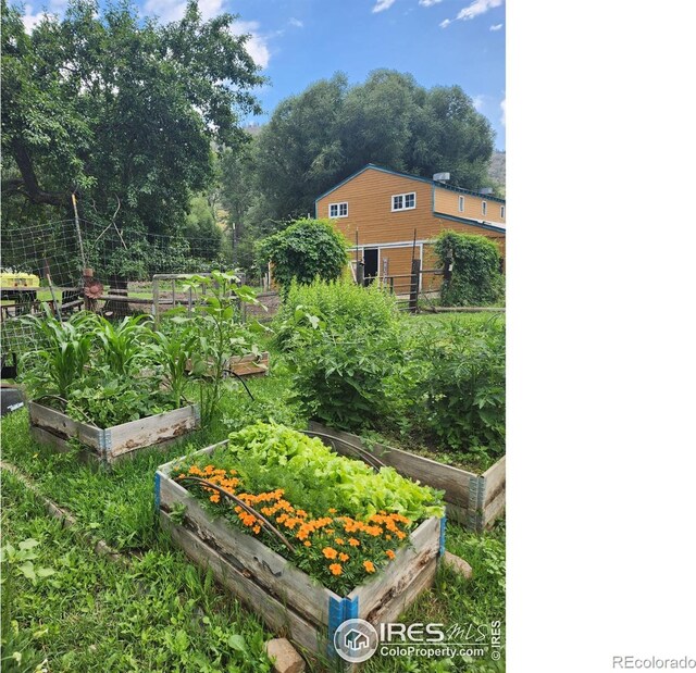 view of yard featuring a garden and fence