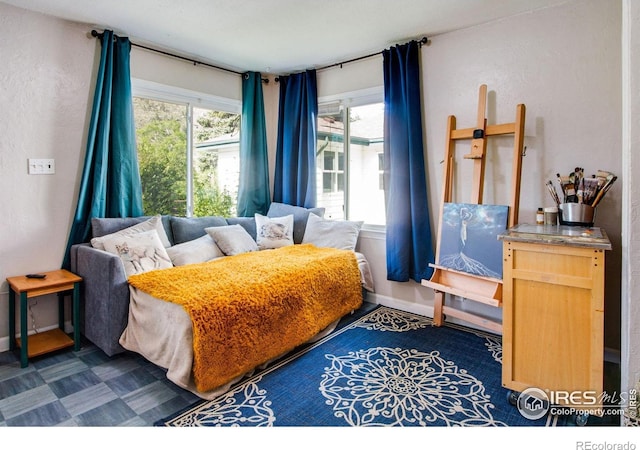 bedroom featuring baseboards