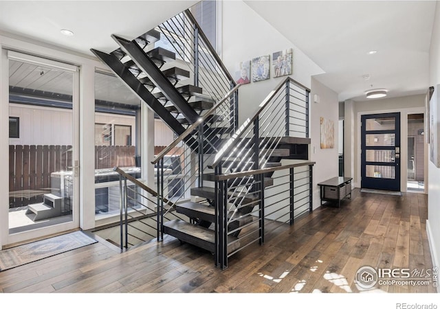 stairway featuring hardwood / wood-style flooring