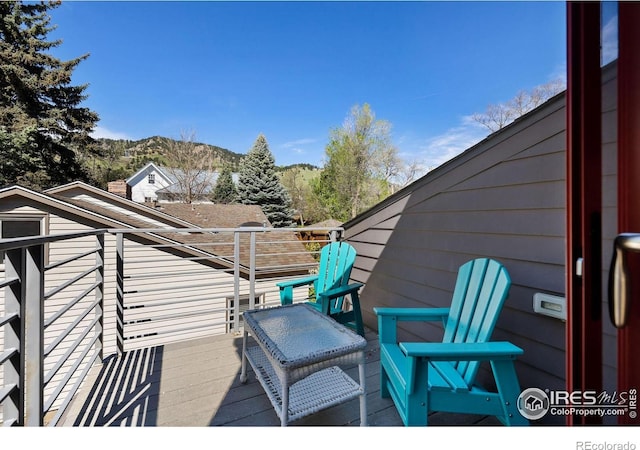 wooden terrace featuring a mountain view