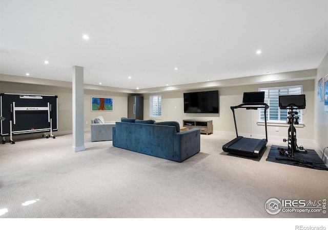 carpeted living room featuring recessed lighting and baseboards