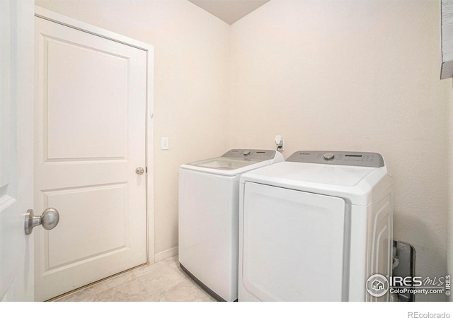 laundry area with washer and dryer