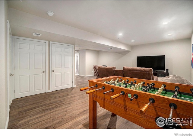 rec room with wood finished floors, recessed lighting, and baseboards