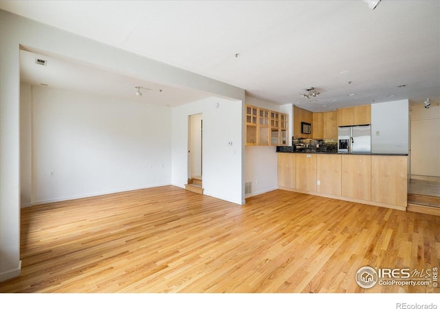 836 Walnut St Unit B, Boulder, CO 80302 - unfurnished living room with light wood-style flooring and baseboards