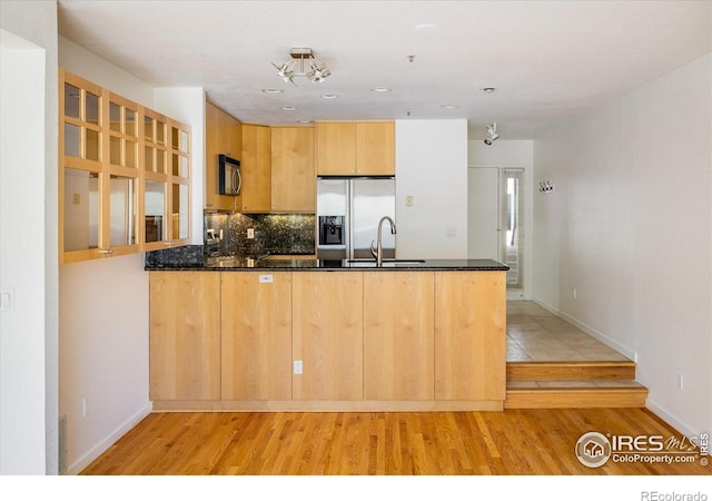 836 Walnut St Unit B, Boulder, CO 80302 - kitchen featuring stainless steel fridge with ice dispenser, a peninsula, light wood-style floors, and a sink