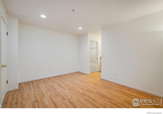 836 Walnut St Unit B, Boulder, CO 80302 - unfurnished room with light wood-type flooring, baseboards, recessed lighting, a smoke detector, and fire sprinkler in ceiling