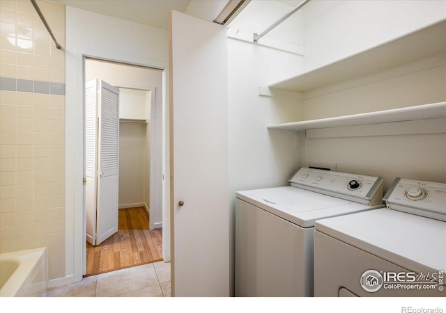 836 Walnut St Unit B, Boulder, CO 80302 - laundry room with independent washer and dryer, light tile patterned flooring, and baseboards