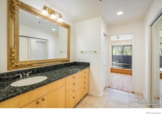 836 Walnut St Unit B, Boulder, CO 80302 - bathroom with tile patterned floors, vanity, baseboards, and recessed lighting