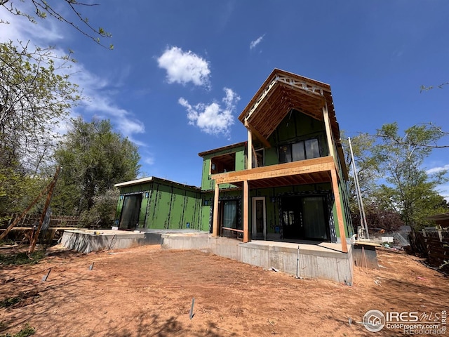 rear view of property with a patio area