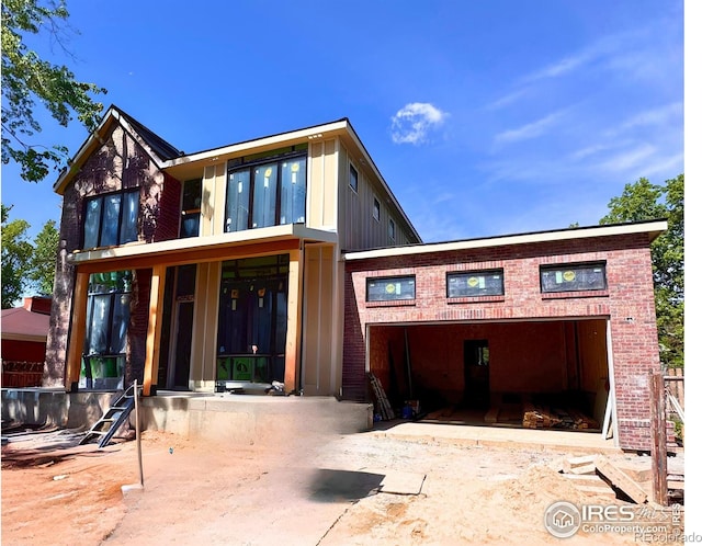2941 21st St, Boulder, CO 80304 - back of house featuring brick siding and board and batten siding