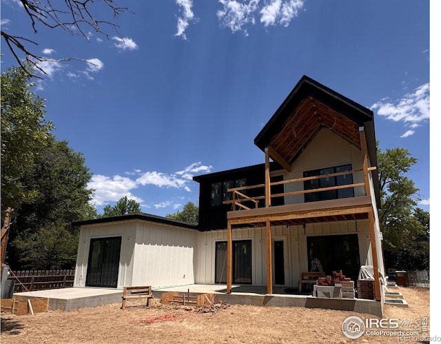 2941 21st St, Boulder, CO 80304 - back of house featuring a patio area, board and batten siding, and a balcony