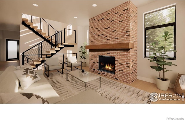 2941 21st St, Boulder, CO 80304 - living area featuring wood finished floors, stairs, a brick fireplace, and recessed lighting