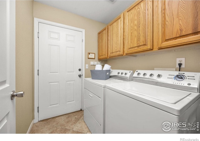 316 Whitney Bay, Windsor, CO 80550 - laundry room with separate washer and dryer, cabinet space, light tile patterned floors, and baseboards