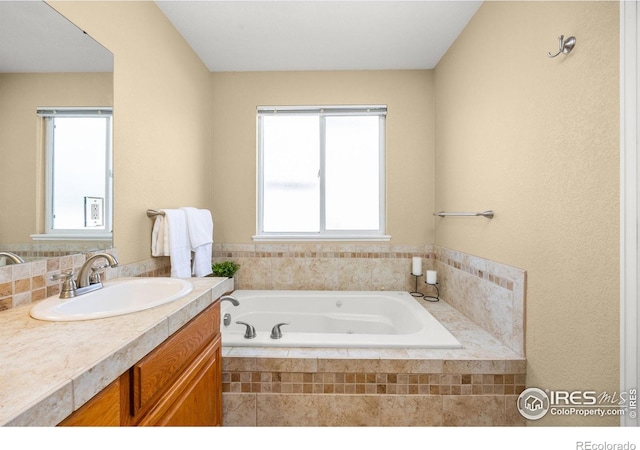 316 Whitney Bay, Windsor, CO 80550 - bathroom featuring a garden tub and vanity