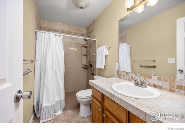 316 Whitney Bay, Windsor, CO 80550 - full bath featuring toilet, tiled shower, tile patterned floors, and vanity