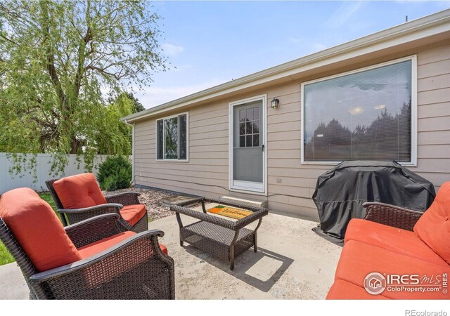 316 Whitney Bay, Windsor, CO 80550 - view of patio with fence, area for grilling, and an outdoor hangout area