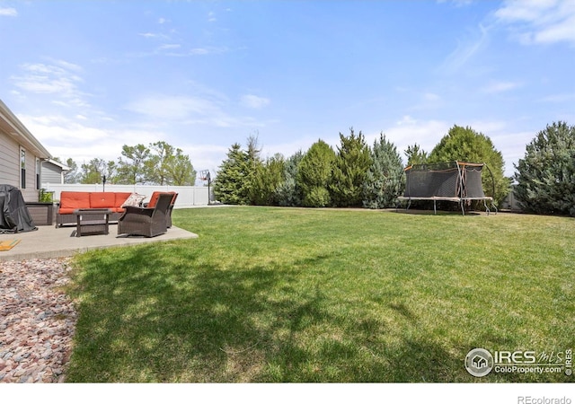316 Whitney Bay, Windsor, CO 80550 - view of yard featuring an outdoor hangout area, a trampoline, and a patio area