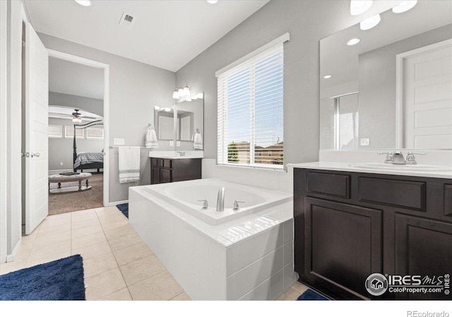 6111 Story Rd, Timnath, CO 80547 - ensuite bathroom featuring a bath, two vanities, tile patterned flooring, recessed lighting, and ceiling fan
