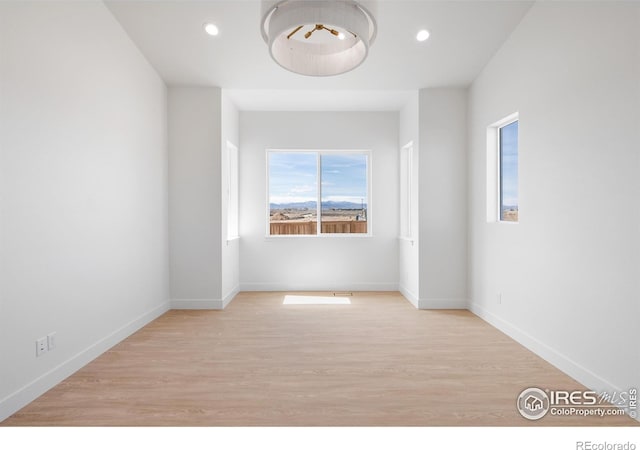 20 Snowcap Dr, Windsor, CO 80550 - unfurnished room with wood finished floors, recessed lighting, and baseboards