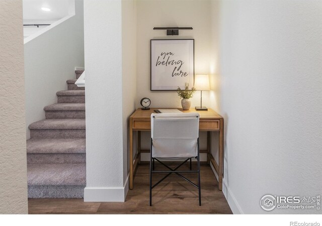 home office with wood finished floors and baseboards