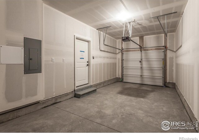 garage with electric panel and a garage door opener