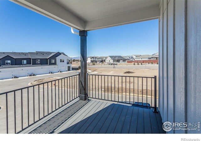wooden deck featuring a residential view