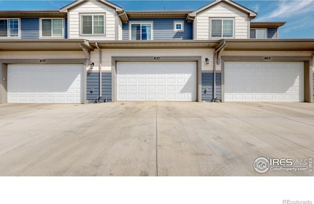 4157 Trapper Lake Dr, Loveland, CO 80538 - view of front facade with a garage and driveway