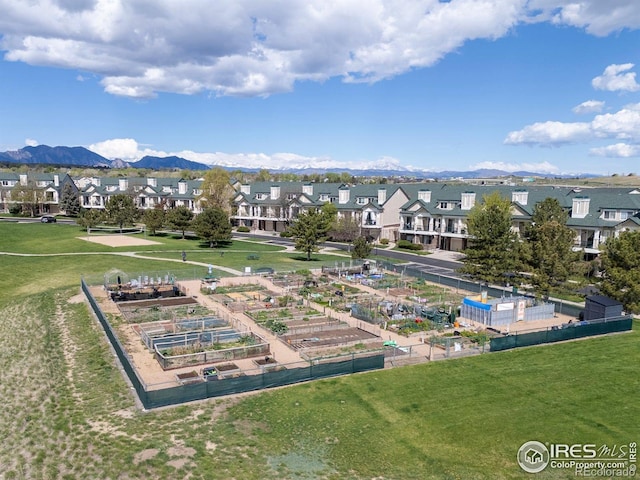 surrounding community featuring a residential view, a yard, and a mountain view