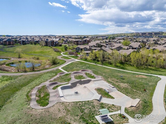 aerial overview of property's location with nearby suburban area and a large body of water