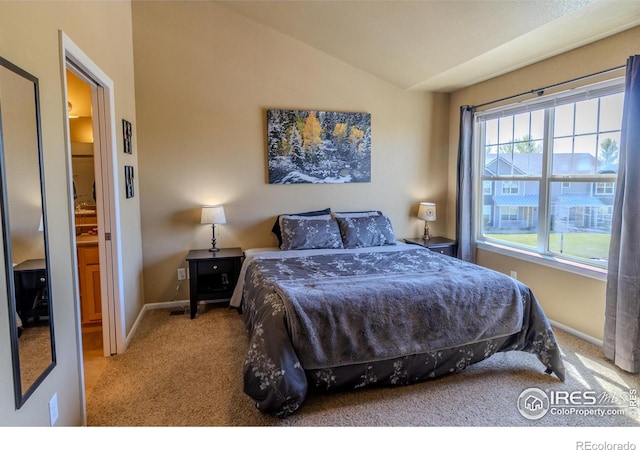 bedroom with carpet flooring, lofted ceiling, and baseboards