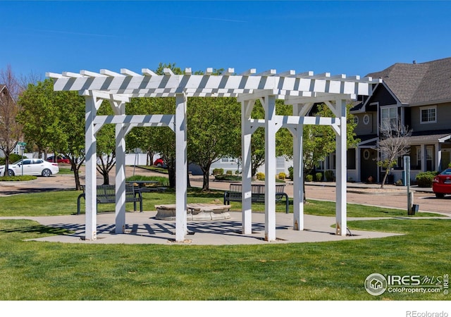 surrounding community with a lawn and a pergola