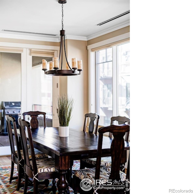 dining room with crown molding