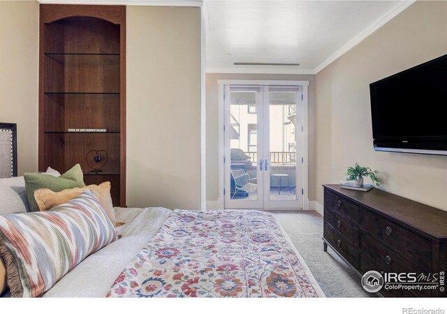 bedroom featuring french doors, access to exterior, carpet floors, crown molding, and baseboards