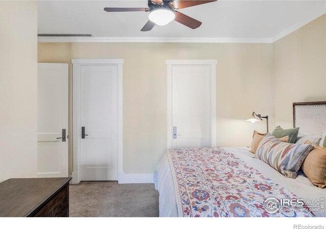 bedroom featuring carpet, crown molding, a ceiling fan, and baseboards
