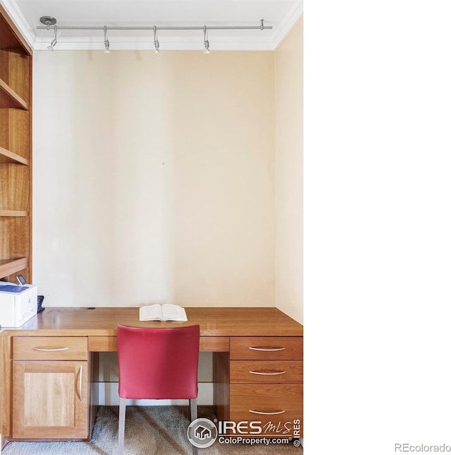 office featuring built in desk and ornamental molding