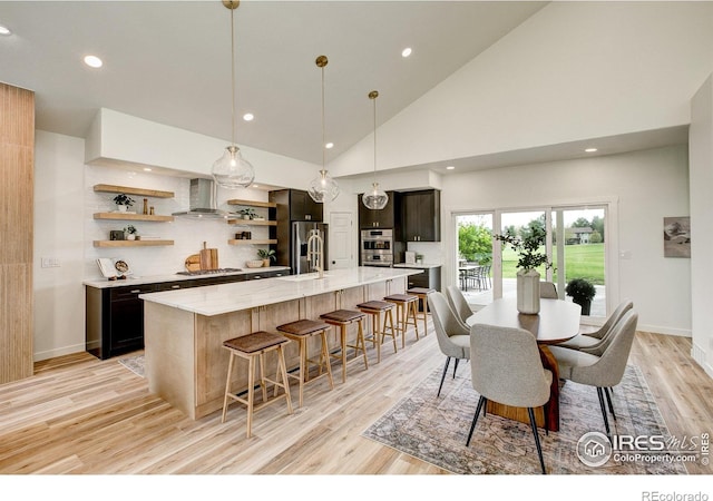 5304 Vardon Way, Fort Collins, CO 80528 - dining area featuring light wood finished floors, recessed lighting, and high vaulted ceiling