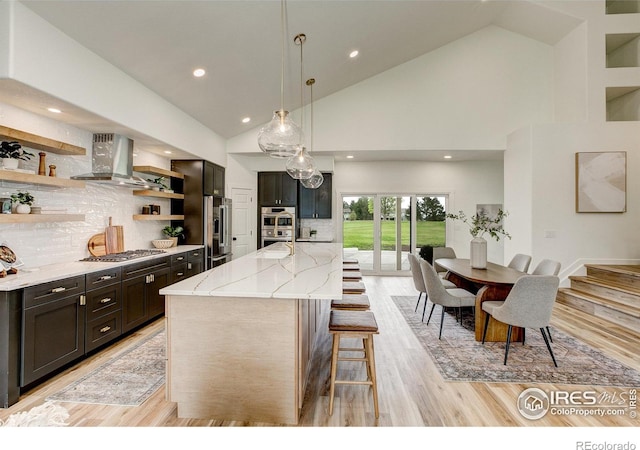 5304 Vardon Way, Fort Collins, CO 80528 - kitchen featuring island exhaust hood, open shelves, stainless steel appliances, light stone counters, and a kitchen bar