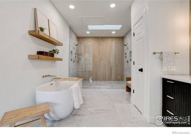 5304 Vardon Way, Fort Collins, CO 80528 - full bathroom featuring a shower stall, a freestanding bath, marble finish flooring, recessed lighting, and vanity