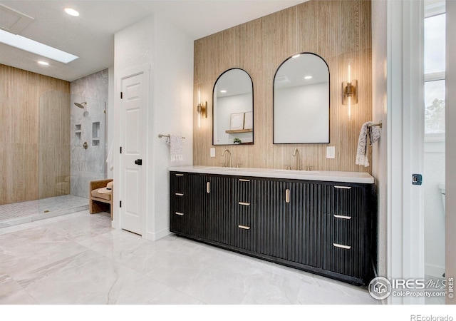5304 Vardon Way, Fort Collins, CO 80528 - bathroom with double vanity, a tile shower, marble finish floors, and recessed lighting