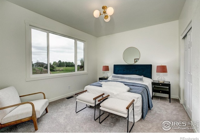 5304 Vardon Way, Fort Collins, CO 80528 - carpeted bedroom with a closet and a chandelier