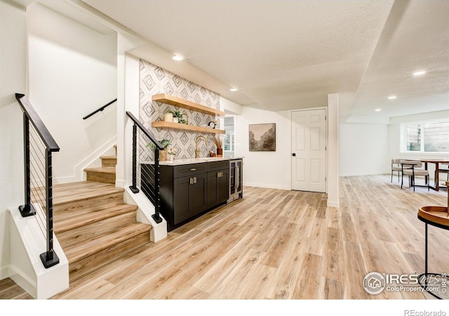 5304 Vardon Way, Fort Collins, CO 80528 - bar with light wood-style flooring, wine cooler, stairway, and recessed lighting