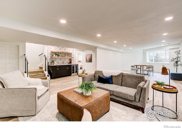 5304 Vardon Way, Fort Collins, CO 80528 - living area featuring beverage cooler, light wood-style floors, recessed lighting, and stairs
