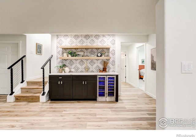 5304 Vardon Way, Fort Collins, CO 80528 - indoor dry bar with wine cooler, light wood-style floors, and stairs