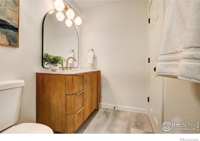5304 Vardon Way, Fort Collins, CO 80528 - half bath featuring wood finished floors and vanity